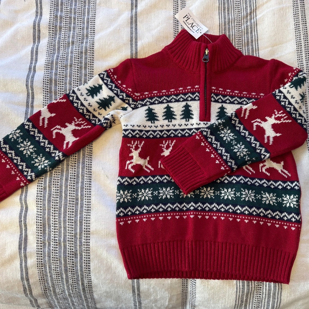 Quarter zip sweater, holiday themed. Handsome!